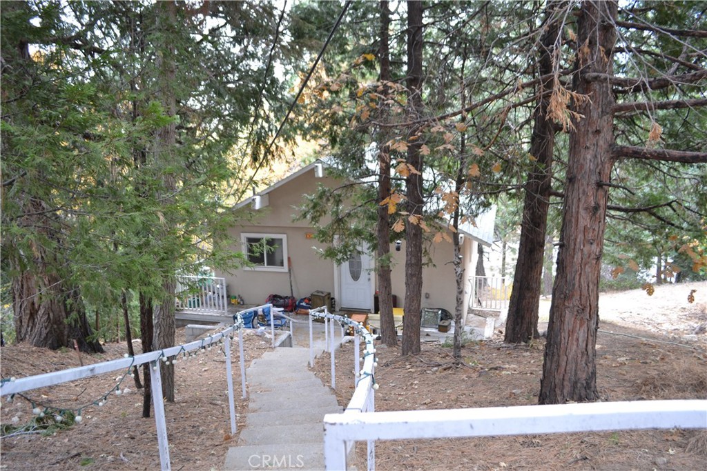 a view of a house with backyard porch and sitting area