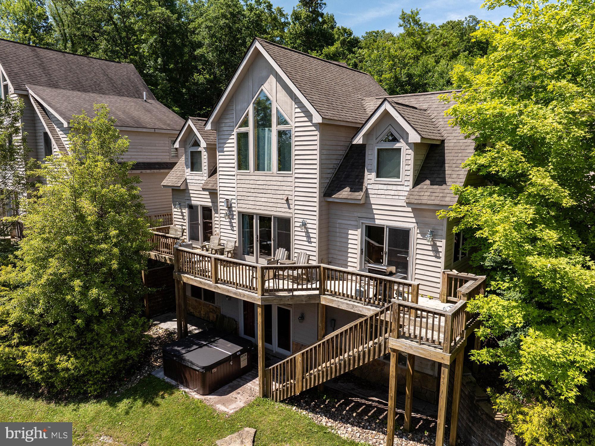 a view of a house with roof deck front of house