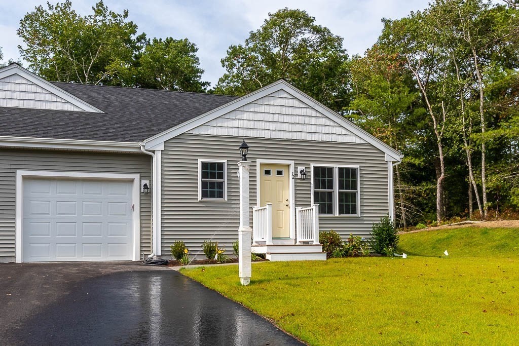 front view of a house with a yard