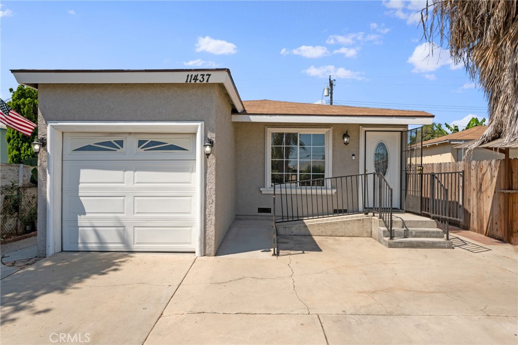 a front view of a house with a garage