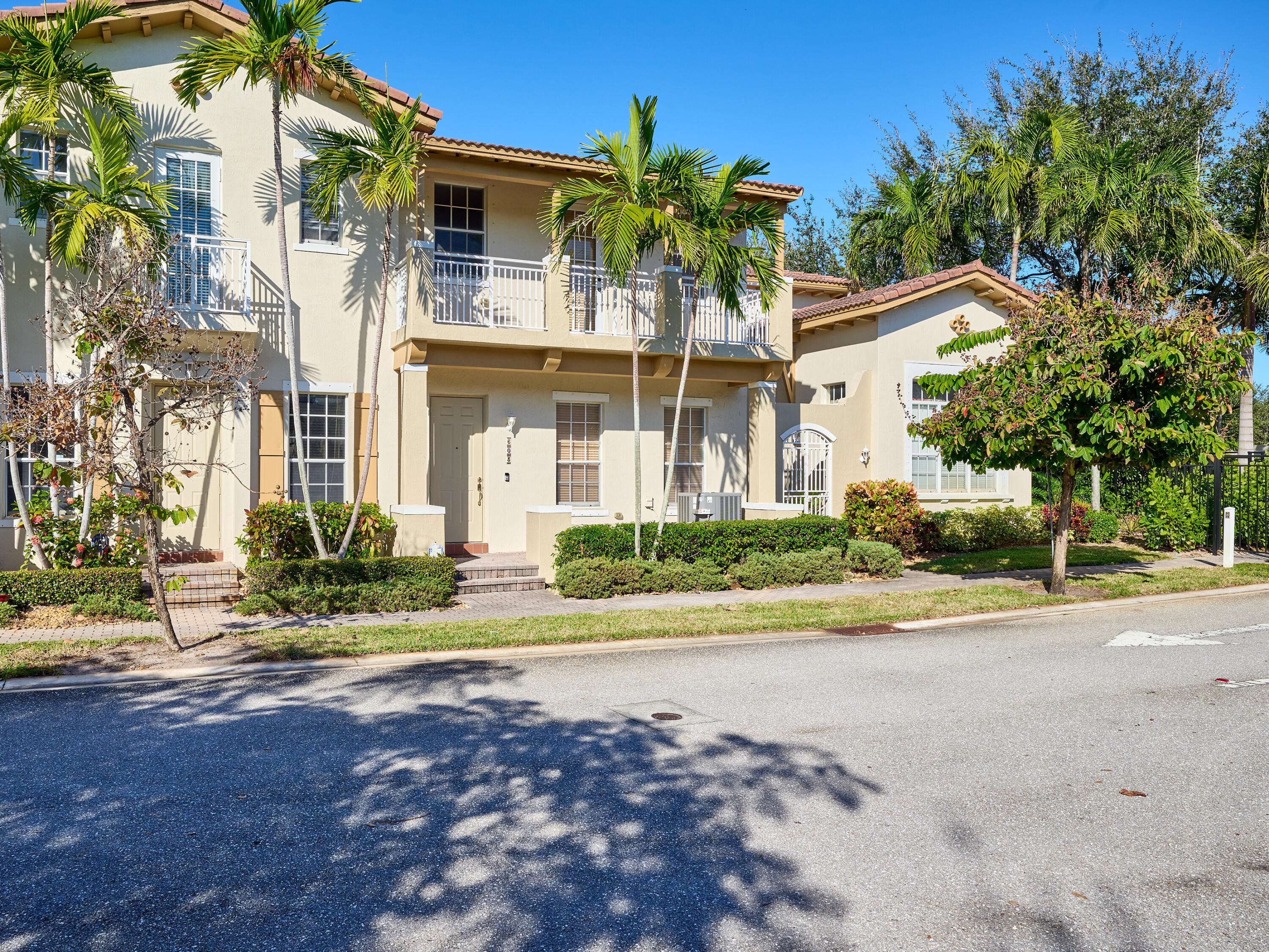 a front view of a house with a yard and a garage