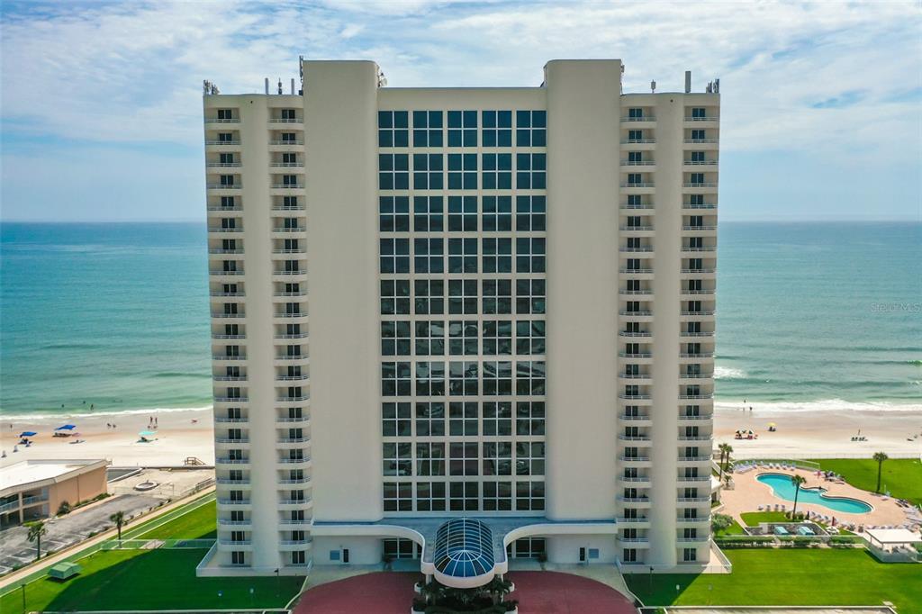 a front view of a building with outdoor space