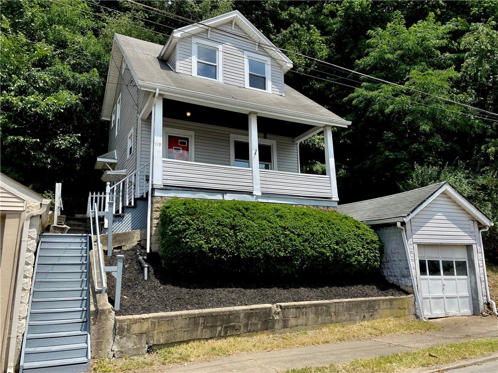 a front view of a house with garage