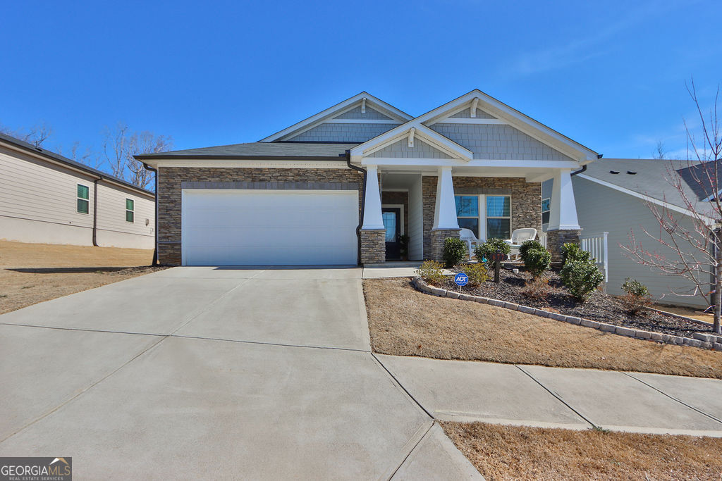 a front view of a house with garage