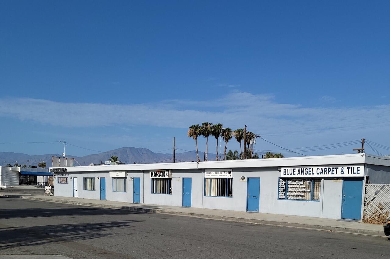 a front view of a building with grey walls