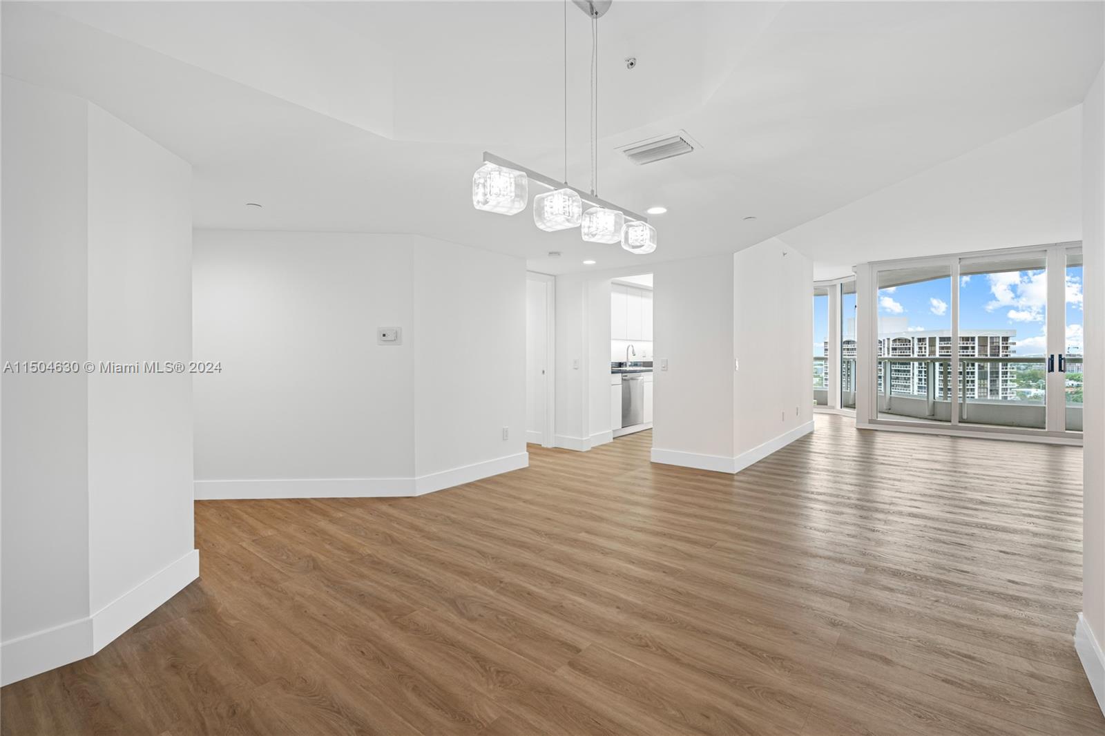 a view of a livingroom with wooden floor