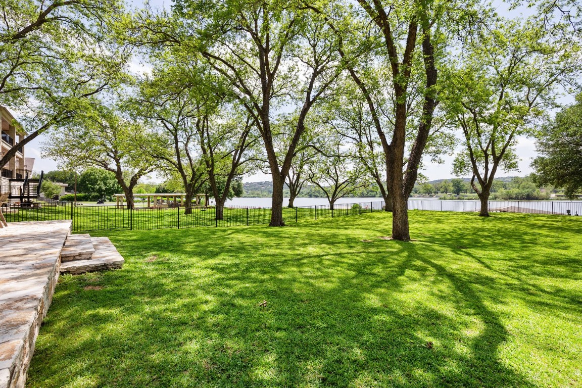 a huge green field with lots of trees