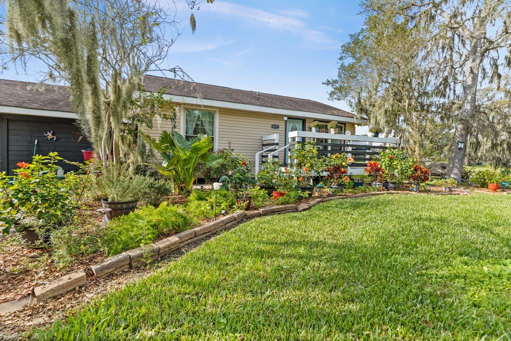 Leading up to the raised patio entry is ample room for your choice of landscaping.