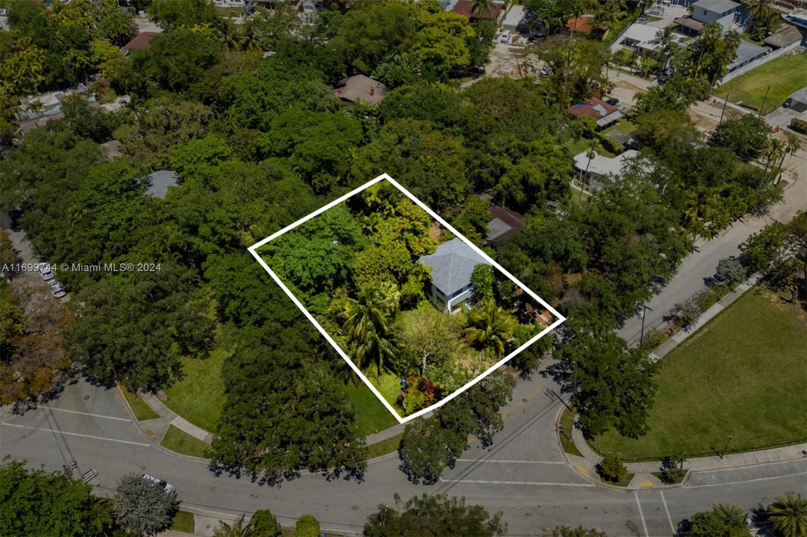 an aerial view of house with a yard