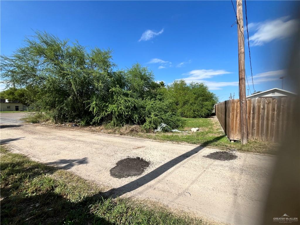 a view of a backyard of the house