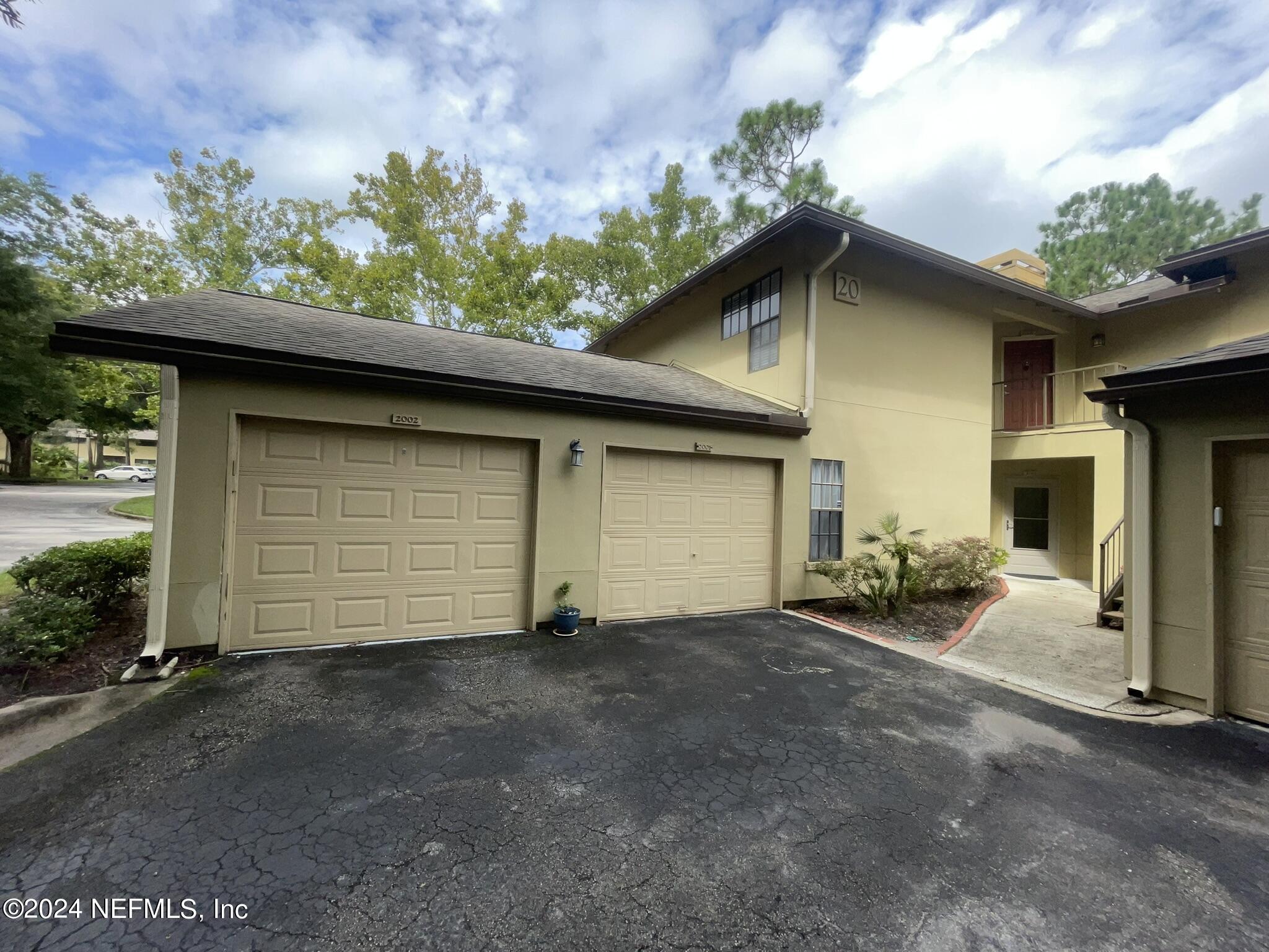 a house with a yard and garage