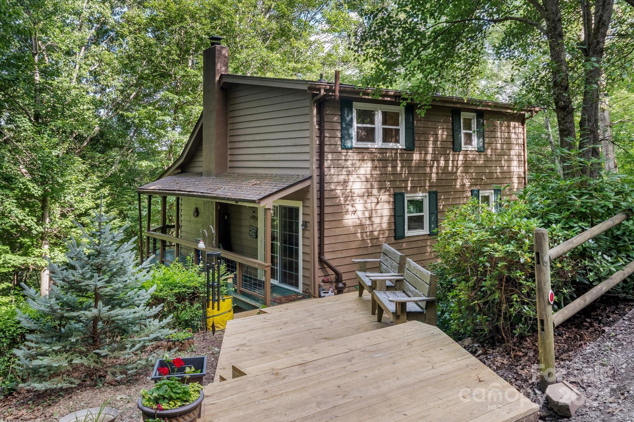 a view of house with backyard space and garden