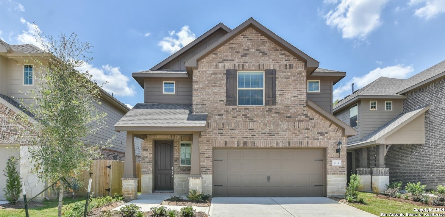 a front view of a house with garage