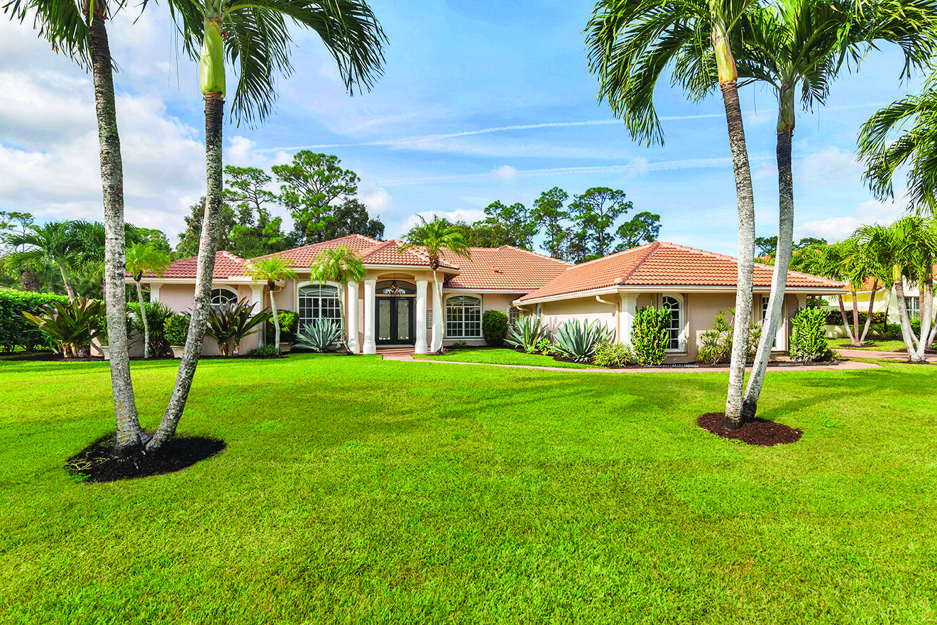 a front view of house with yard and entertaining space