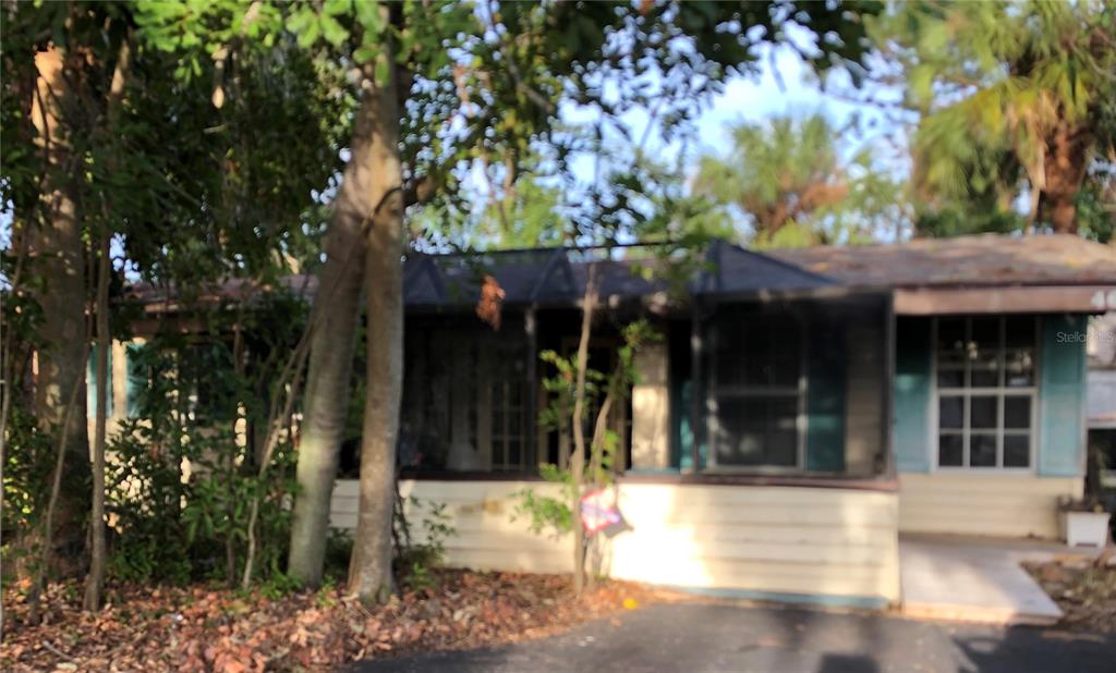 a view of a house with a tree