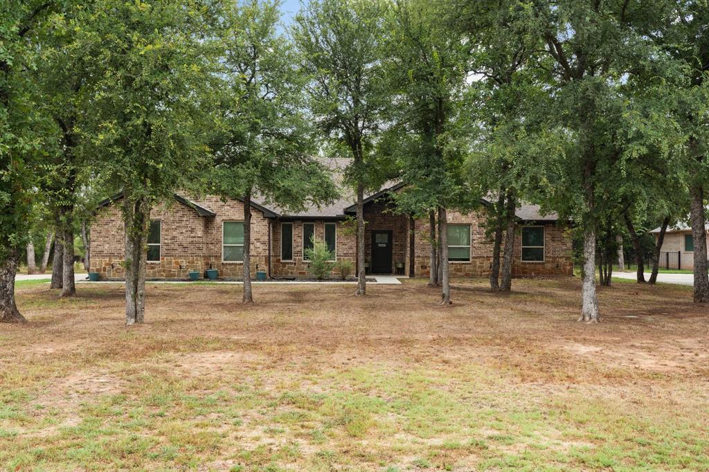 a house with trees in the background