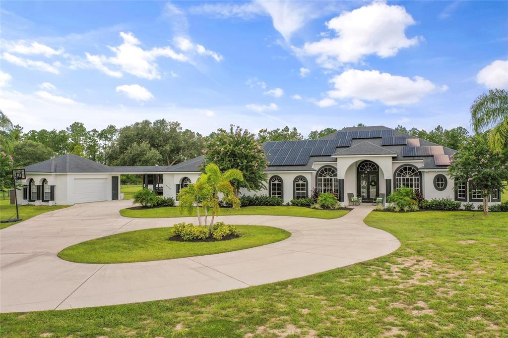 a view of a house with a swimming pool