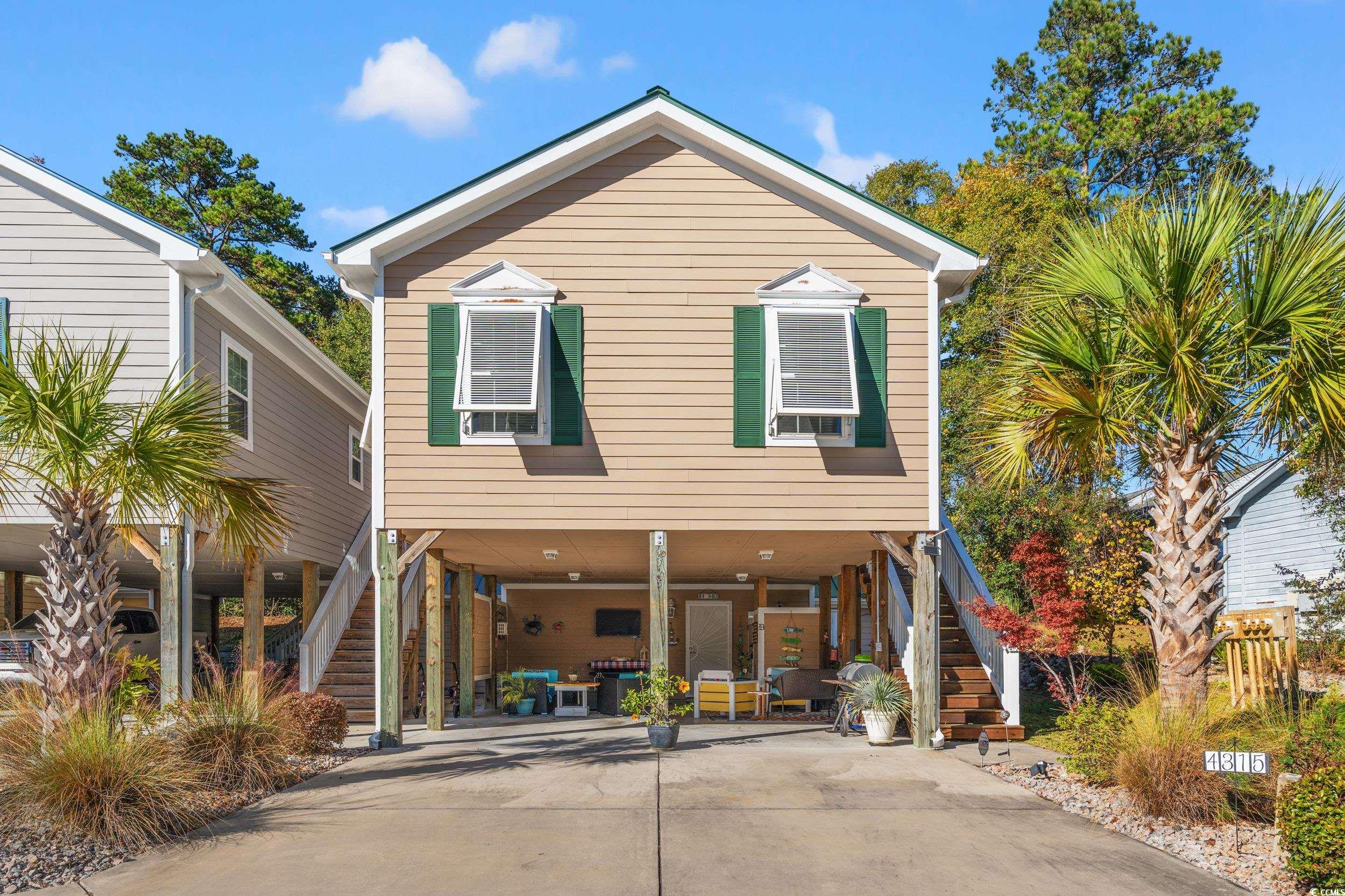 View of front of home with a carport