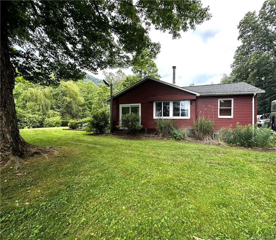 a front view of a house with a yard