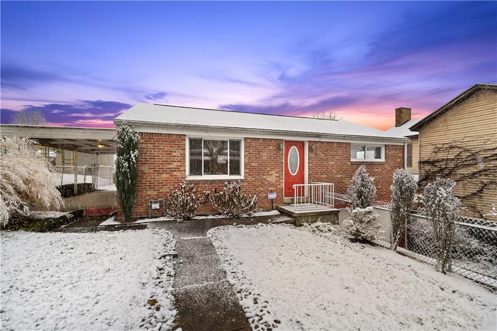 Adorable 2 bed, 2 full bath raised brick ranch with HUGE finished basement and integral garage!