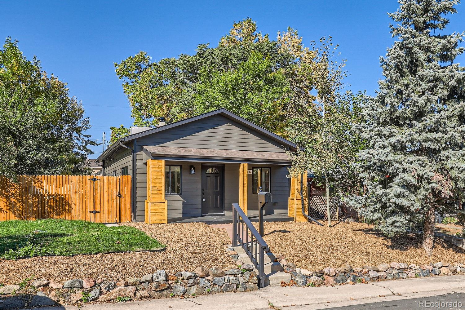 a view of a house with a yard