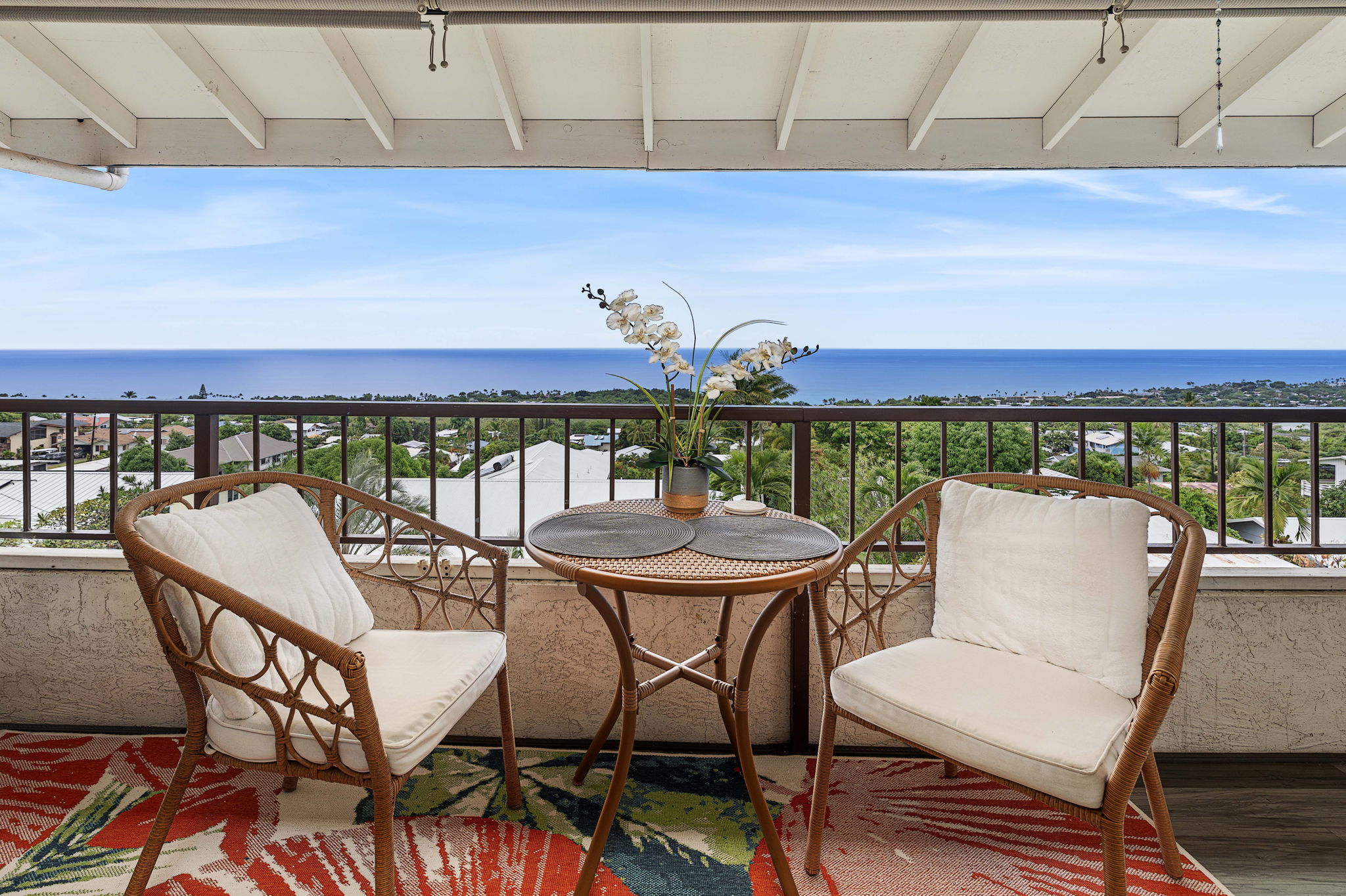 a view of a balcony with chairs