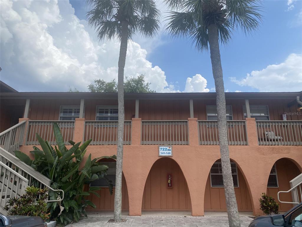 a view of house with palm tree in front