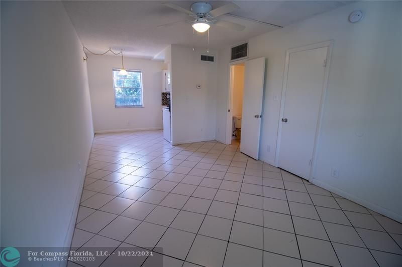 a view of an empty room and window