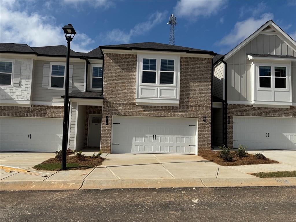 a front view of a house with garage