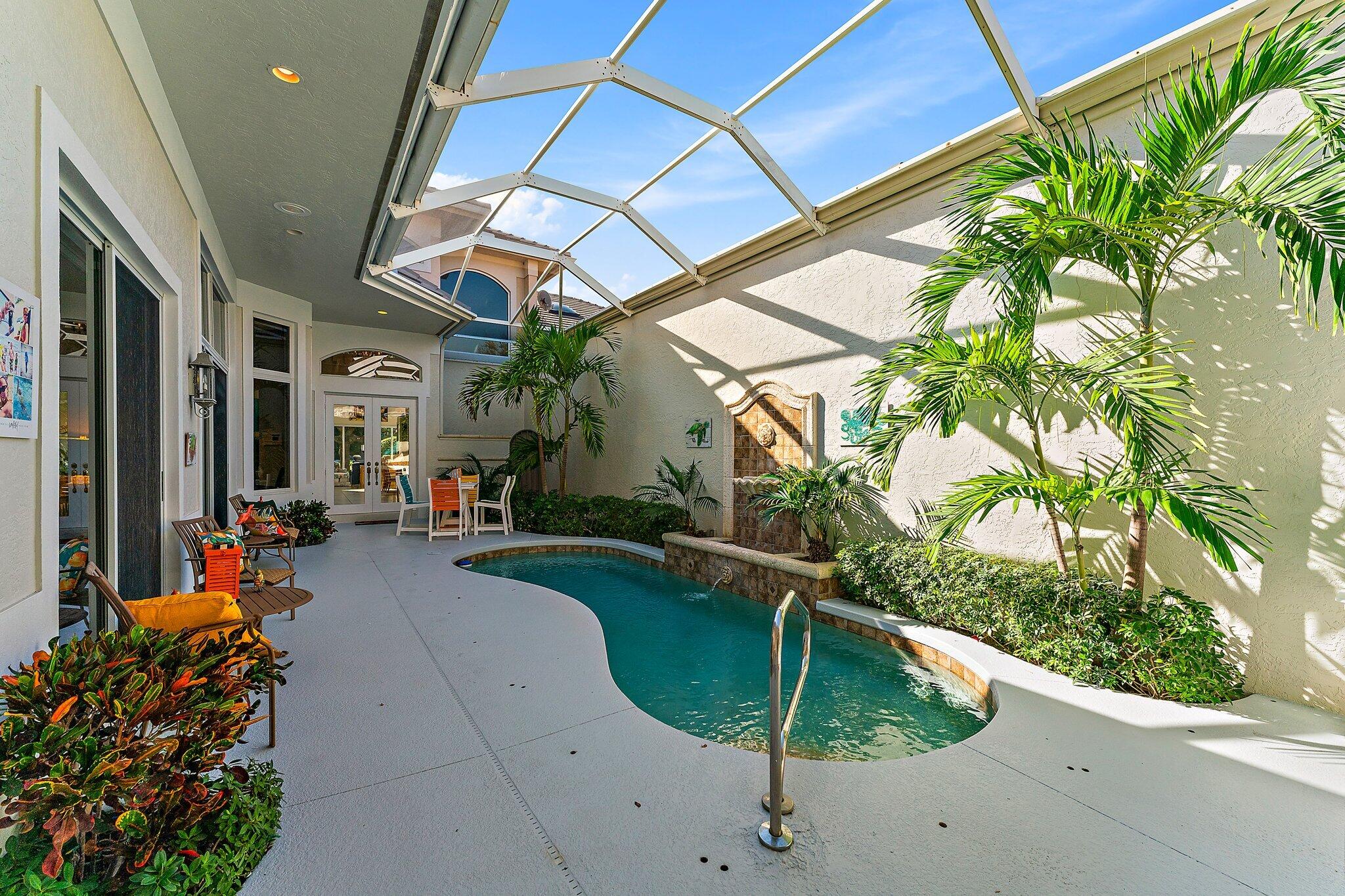 a swimming pool with outdoor seating and yard