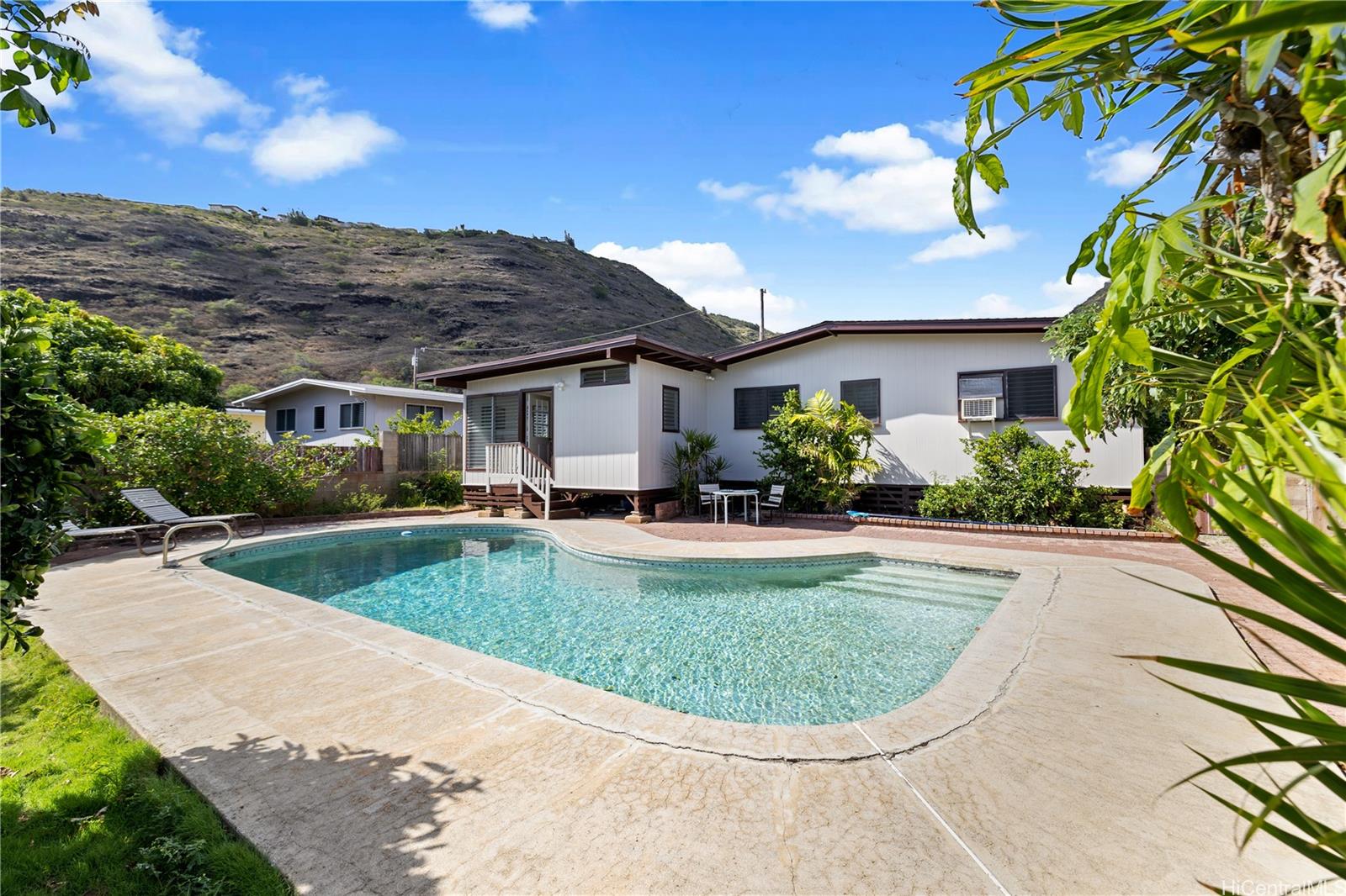 a view of a swimming pool with a patio