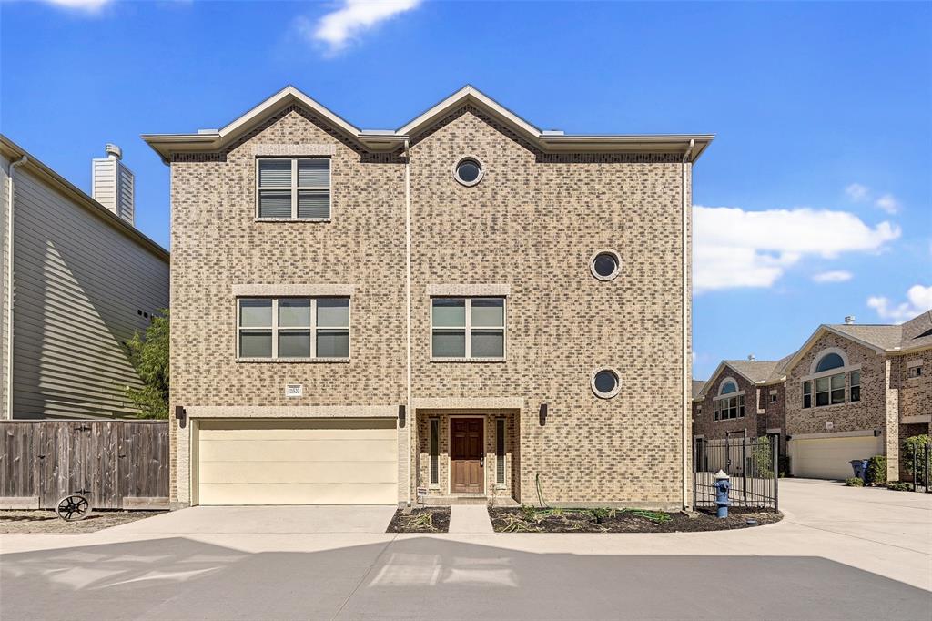 a front view of a house with a parking area