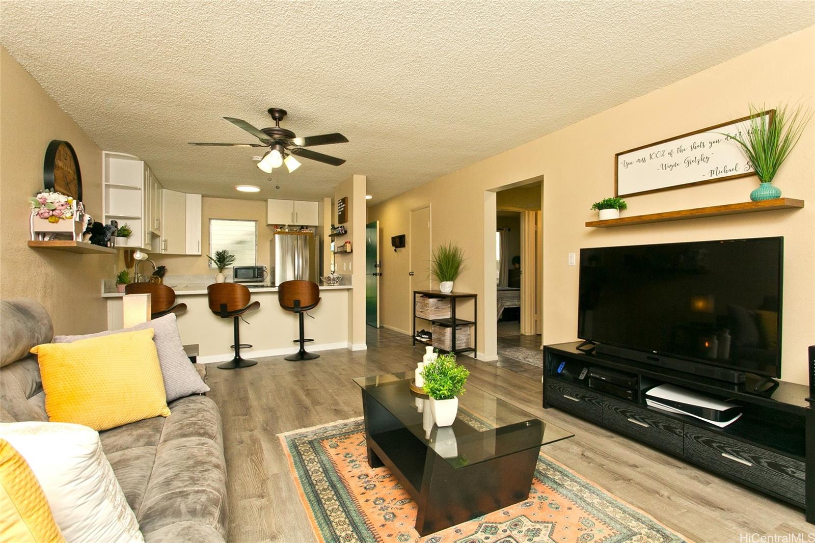 a living room with furniture and a flat screen tv