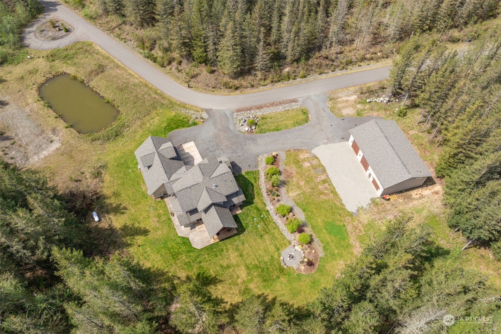 an aerial view of a house with a swimming pool