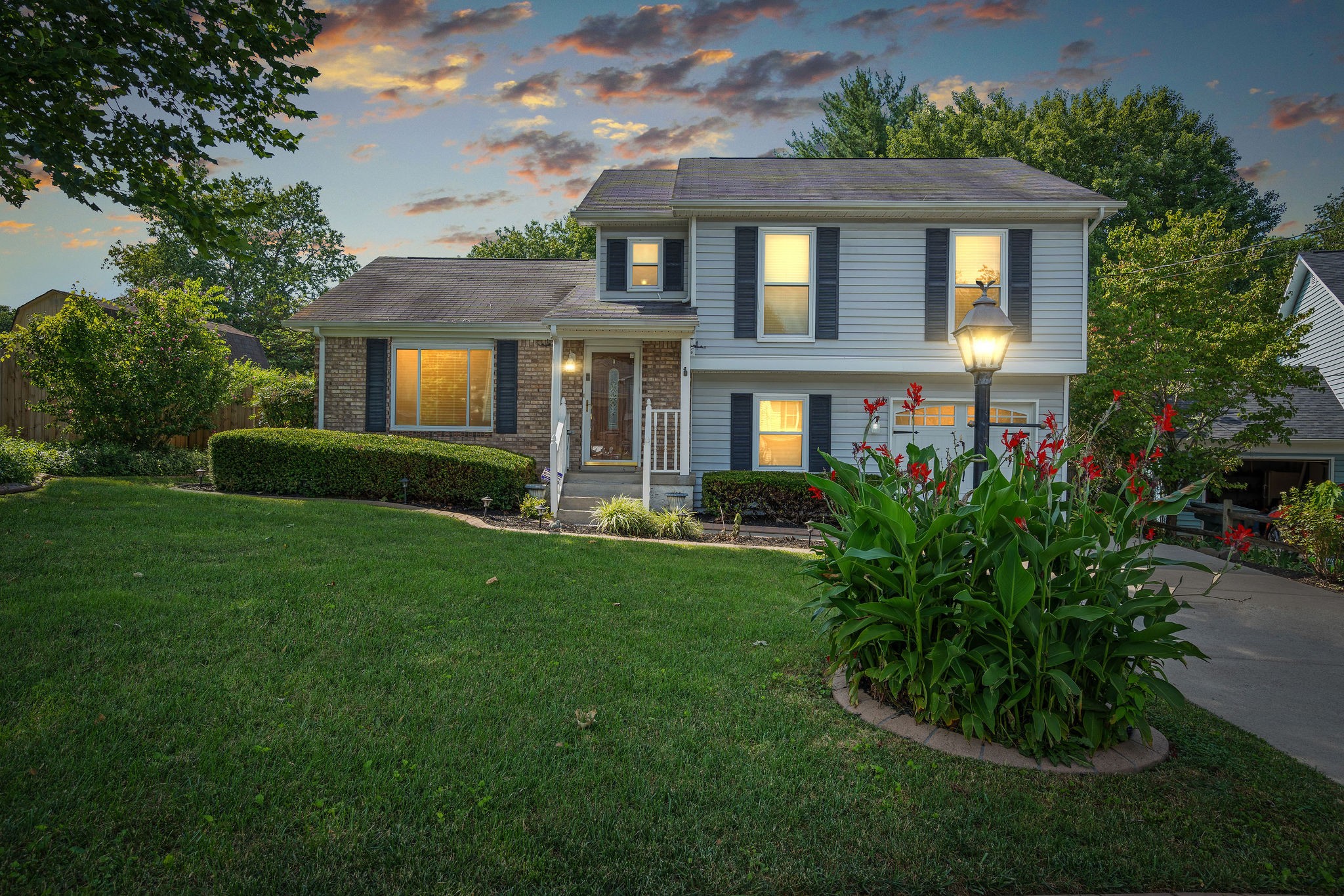 a front view of a house with a yard