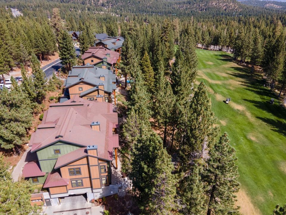 an aerial view of residential houses with outdoor space