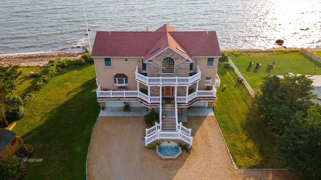 a aerial view of a house with swimming pool and barbeque grill