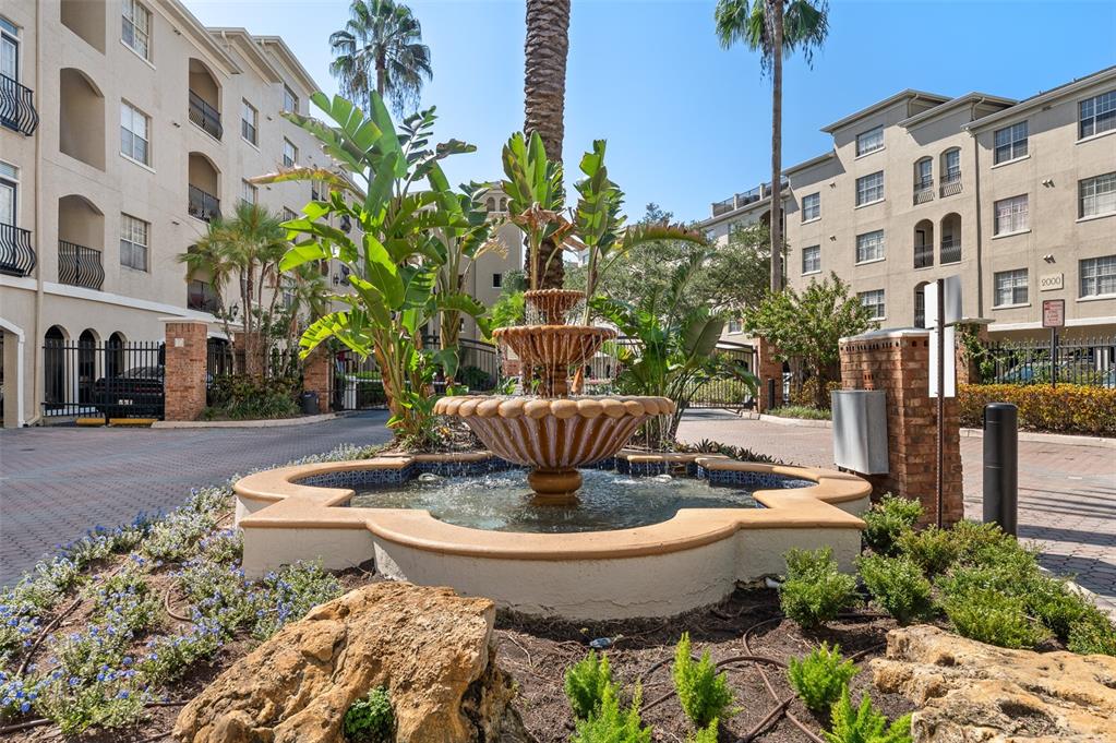 a view of a water fountain in front of building