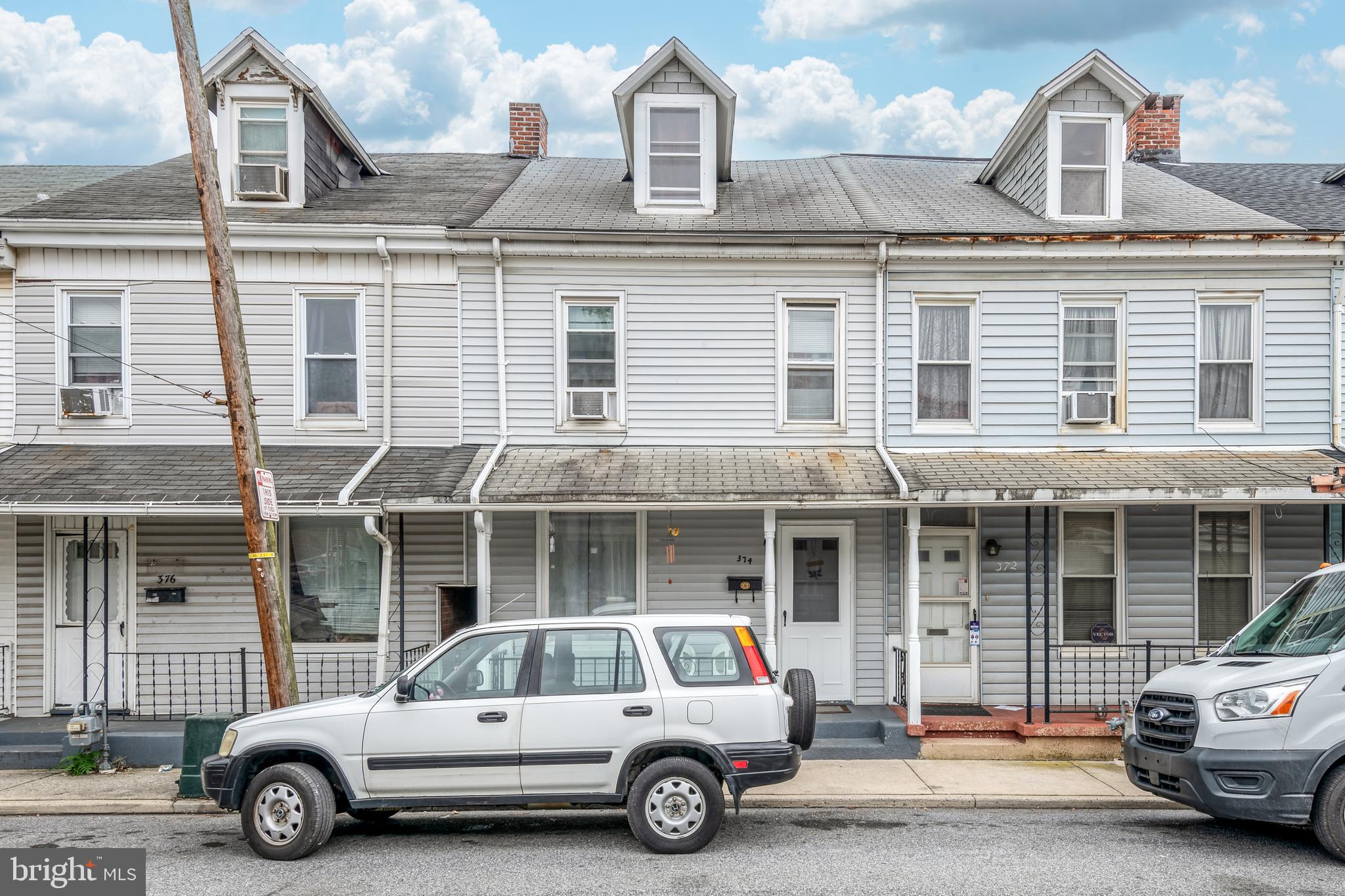 a car parked in front of a house