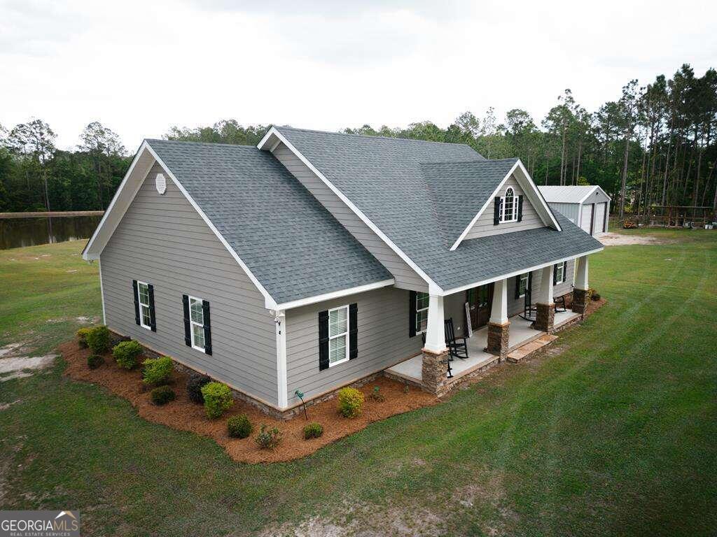 a view of a house with a yard