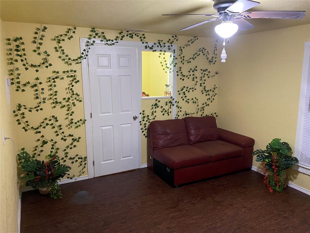 a living room with a couch and a chandelier