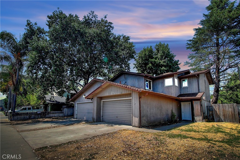 a view of a house with a yard