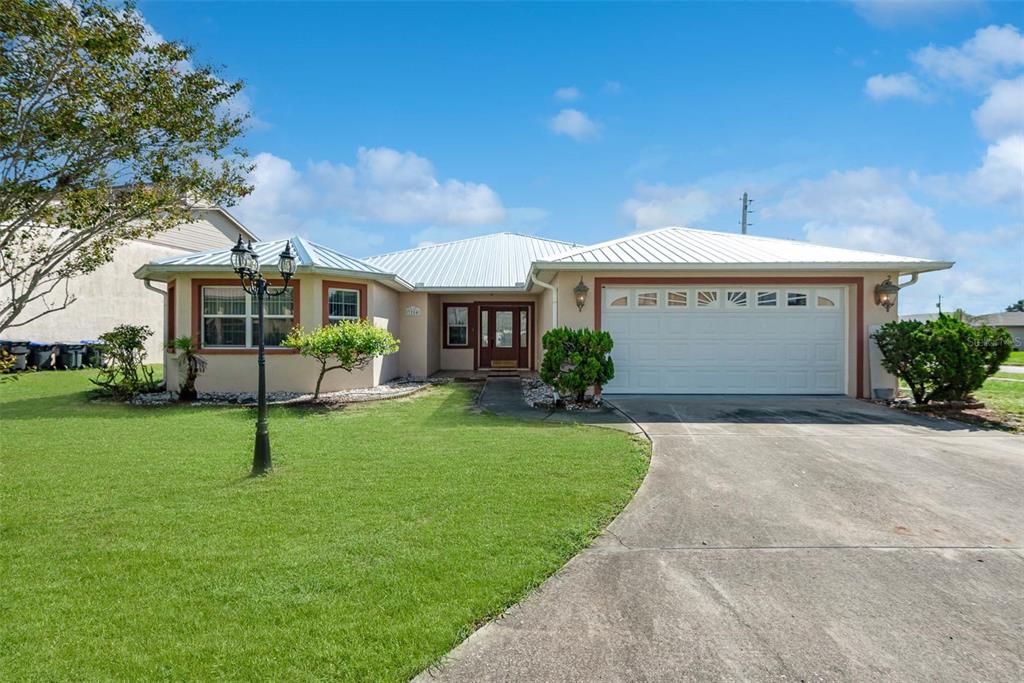 a front view of a house with a yard