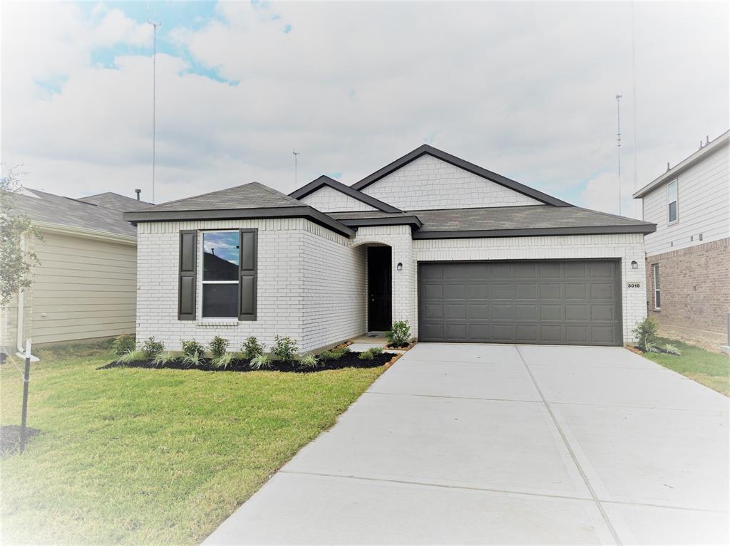 a front view of a house with yard