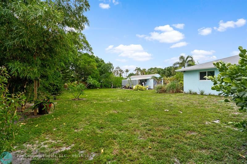 a view of a garden with a house