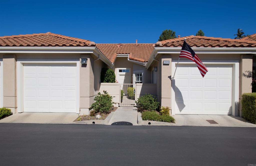 a front view of a house with a garage