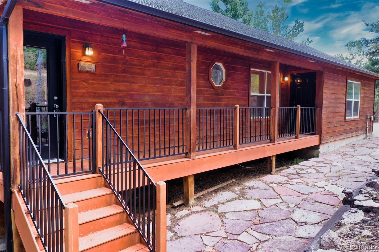 a view of backyard with deck and wooden floor