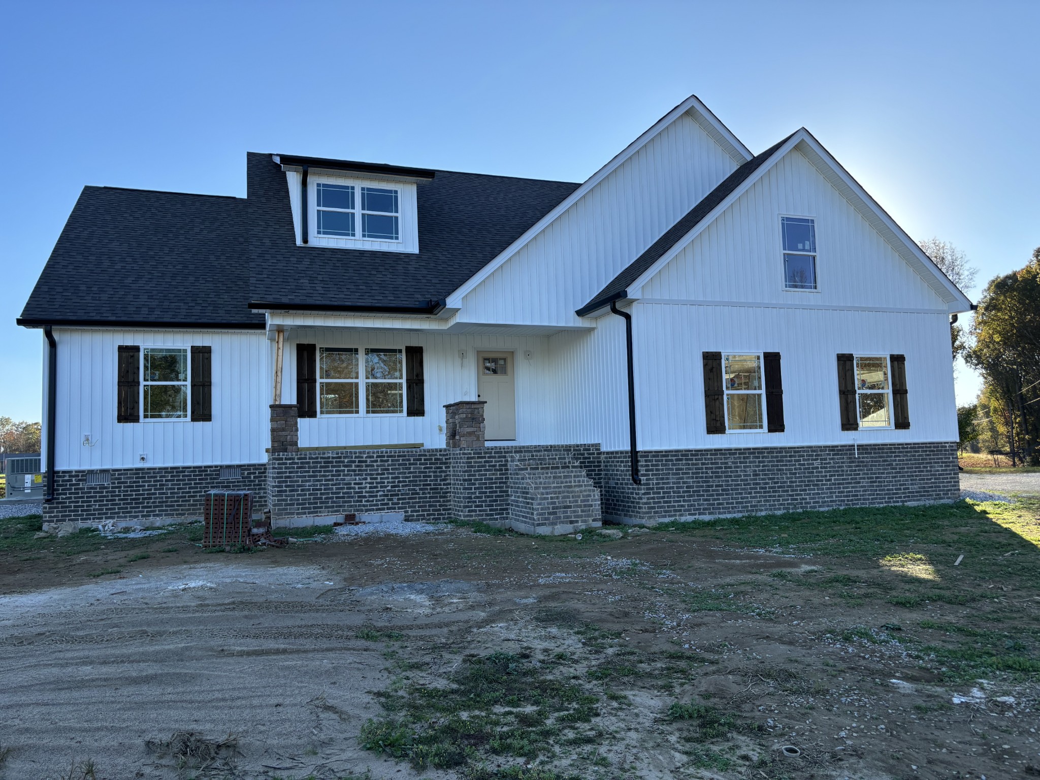 a front view of a house with a yard