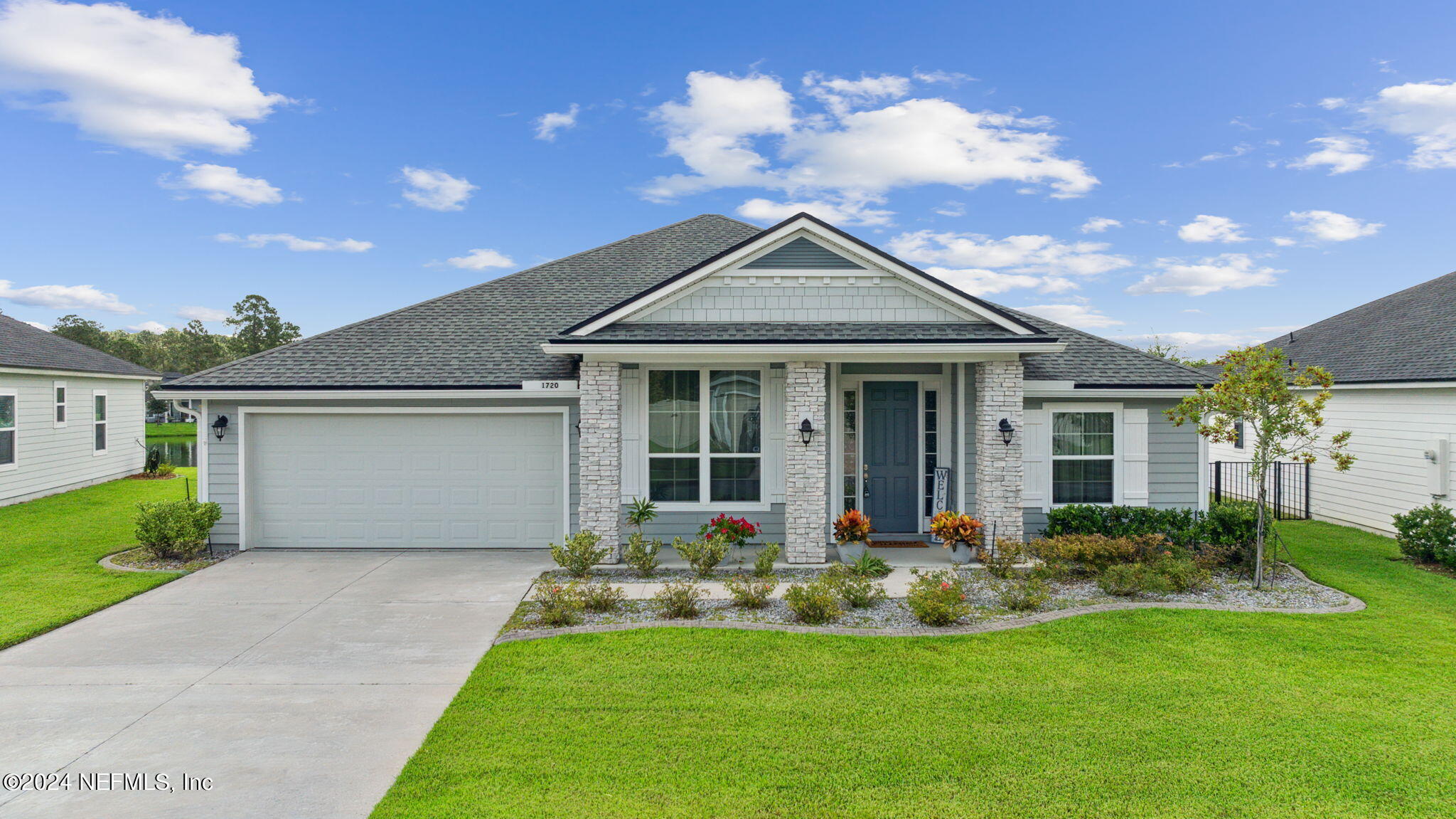 a front view of a house with garden