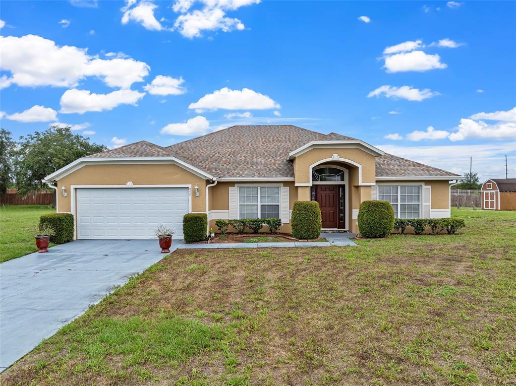 a front view of a house with a yard